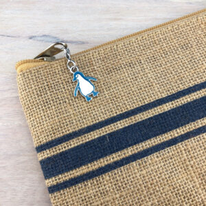 blue penguin attached to purse zipper