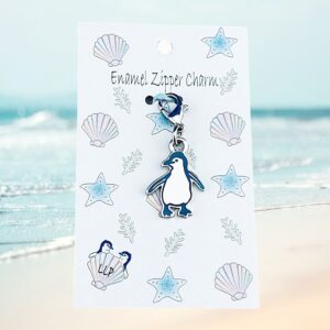 penguin charm blue attached to beach themed packaging