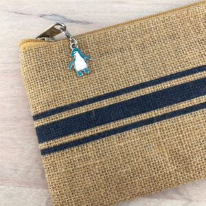 penguin charm attached to purse