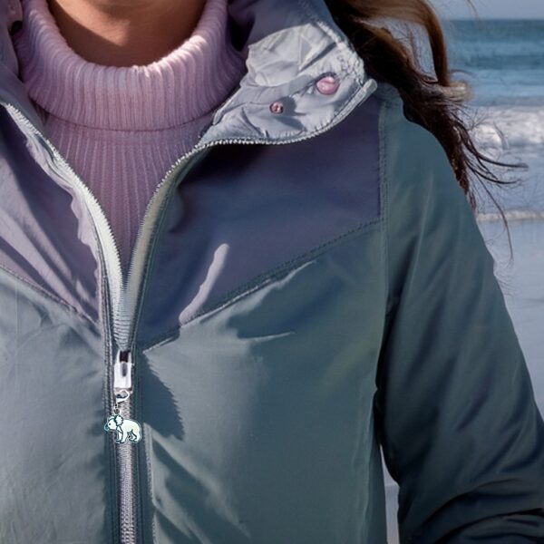 woman wearing parka with coastal koala charm