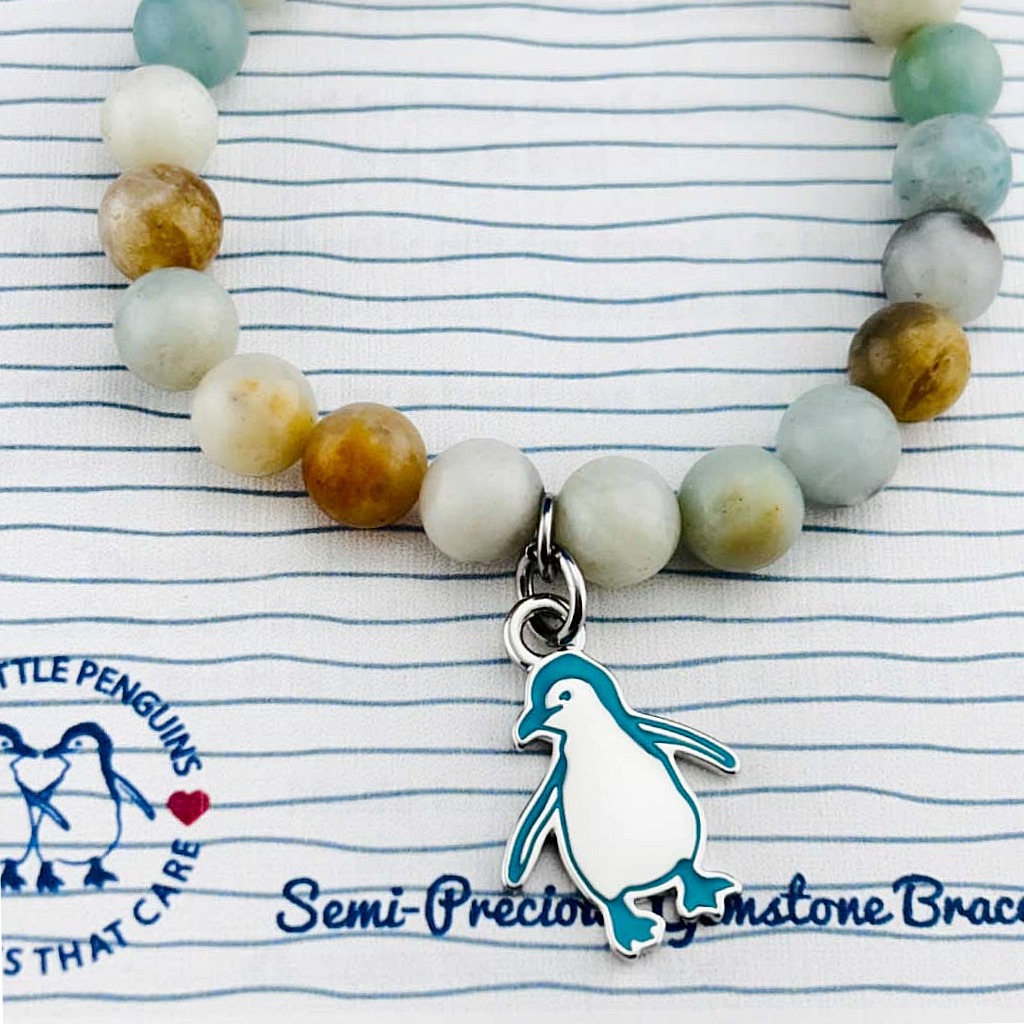 close up of penguin bead bangle
