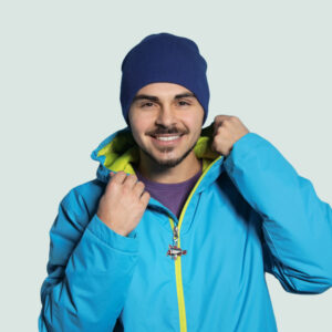 handfish charm attached to man's jacket