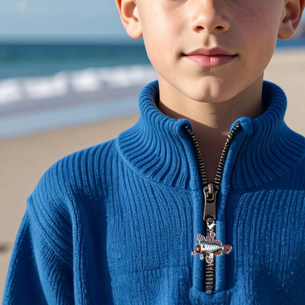 red handfish charm on boy's jumper zipper