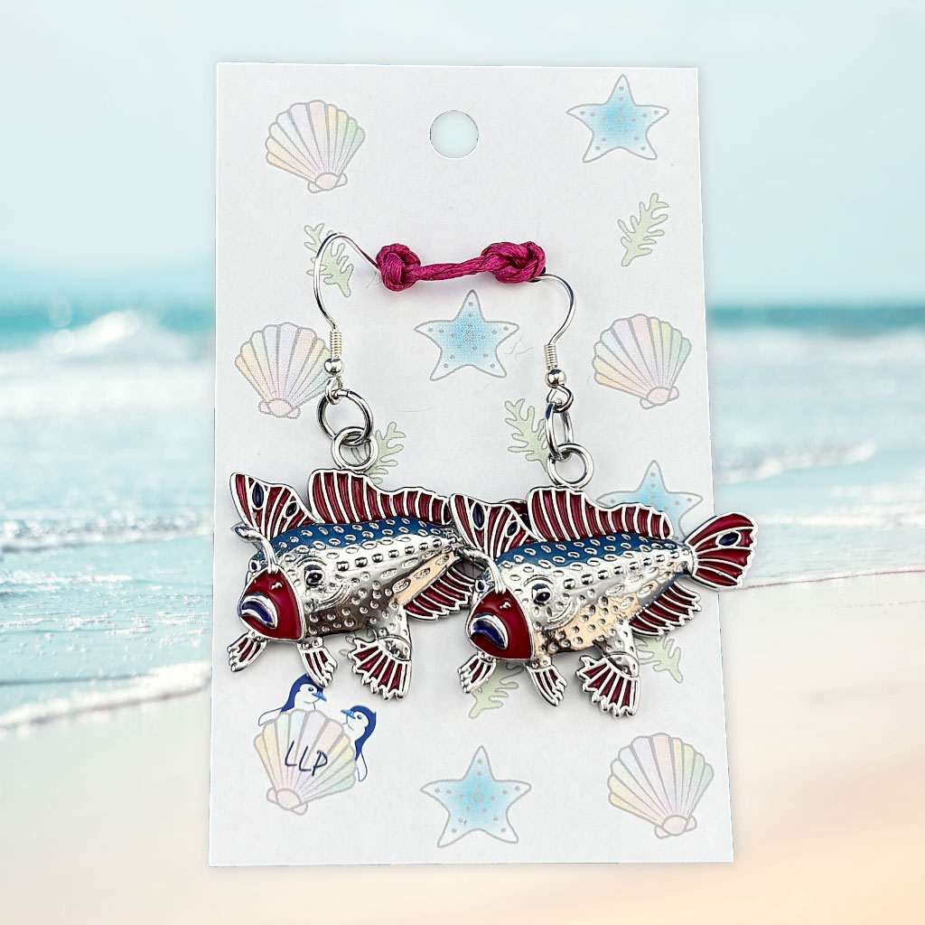 red handfish earrings on beach themed card packaging